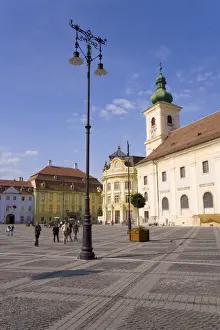 Romanian Prints: Colourfully painted houses and buildings surrounding the main old town square