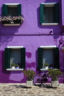 Colourfully painted houses situated on canal banks on the island of Burano Colourfully painted houses situated on canal banks on the island of Burano
