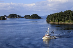 Sitka Prints: Commercial fishing boat and small forested islands, rare summer sun, Sitka Sound