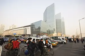 Beijing Prints: Commuters on bicycles and car drivers in the Central Business District business district