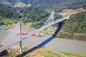 Container ship going under Centenario Bridge (Puente Centenario) and the Panama Canal