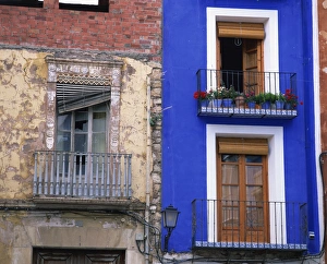 Dilapidated Prints: Contrast between derelict and bright blue painted lived