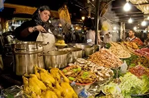 Images Dated 9th April 2010: Cook selling food from her stall in the Djemaa el Fna (Place Jemaa El Fna)