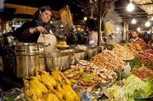 Images Dated 9th April 2010: Cook selling food from her stall in the Djemaa el Fna (Place Jemaa El Fna)