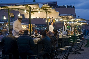 Images Dated 18th November 2009: Cooks selling food from their stalls in the Djemaa el Fna, Place Jemaa el Fna
