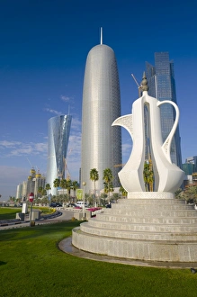Corniche Prints: Corniche, Coffee Pot sculpture with Al Bidda Tower, Burj Qatar and Palm Tower behind