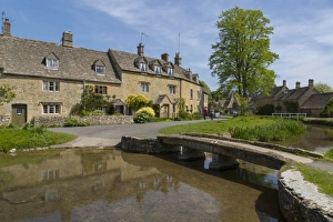 Footbridge Prints: Cottages and footbridge over the River Eye in Lower Slaughter, Cotswolds, Gloucestershire