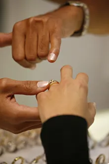Unrecognizable Person Prints: Couple choosing a wedding ring, Paris, France, Europe