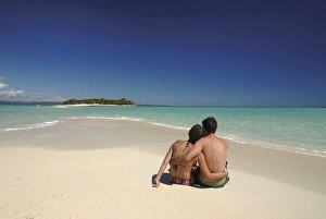 Couple enjoying their honeymoon on the very remote island of Nosy Iranja Couple enjoying their honeymoon on the very remote island of Nosy Iranja