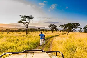 35 39 Years Gallery: Couple enjoying view at a safari camp, Zululand, South Africa