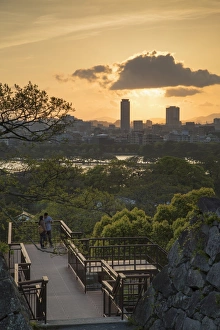 Kyushu Prints: Couple at Fukuoka Castle ruins at sunset, Fukuoka, Kyushu, Japan, Asia