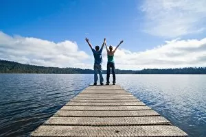 Images Dated 12th April 2011: Couple on a jetty at Lake Ianthe, West Coast, South Island, New Zealand, Pacific