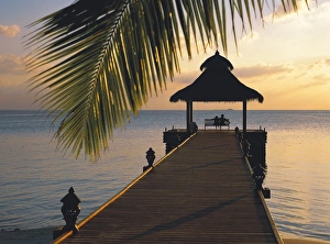 Images Dated 11th May 2008: Couple looking at sunset on a jetty, Maldives, Indian Ocean, Asia