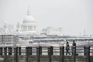 South Bank Collection: Couple on a pier overlooking St. Pauls Cathedral on the banks of the River Thames