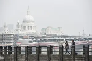 Railings Prints: Couple on a pier overlooking St. Pauls Cathedral on the banks of the River Thames