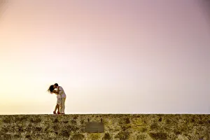 Love Gallery: Couple posing on the old wall, Old Walled-in City, Cartagena, Colombia, South America