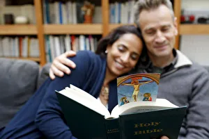 Couples Prints: Couple reading the Bible at home, Paris, France, Europe