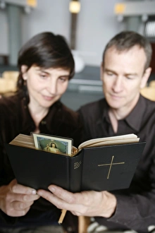 Images Dated 14th March 2007: Couple reading the Bible, Paris, France, Europe