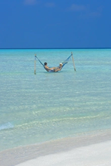 Hammock Prints: Couple relaxing in hammock, Maldives, Indian Ocean, Asia
