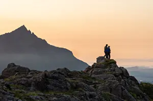 2 People Prints: A couple standing on a rocky peak watching a mountain sunset with Sgurr nan Gillean in