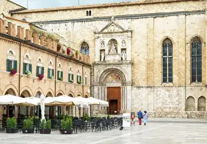 Romance Prints: A couple walking towards the Church of San Francesco (the Basilica di San Francesco) in Piazza del Popolo