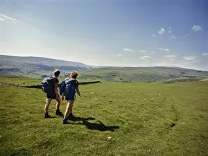 Couple walking on The Dalesway long distance footpath, near Kettlewell