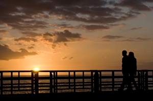 Playa De Las Americas Prints: Couple walking along the pier of Playa de las Americas, Tenerife, Canary Islands