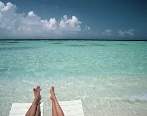 Images Dated 9th August 2010: Couples legs on a beach, Maldives, Indian Ocean, Asia