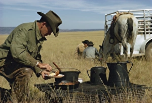 Eating Prints: Cowboys eating breakfast in a field