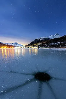 Engadine Prints: Cracked ice on the frozen surface of Lake Champfer in winter