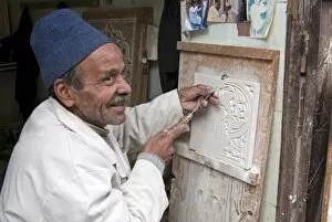 Images Dated 18th November 2009: Craftsman at work on stucco carving, the Souk, Marrakech (Marrakesh), Morocco