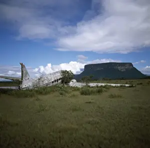 Estado Bolivar Prints: Crashed DC3 aircraft at Alto Carrao with Amauray-tepui in background, Gran Sabana