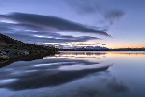 Valtellina Prints: Crazy clouds reflected in the Arcoglio Lake at sunrise