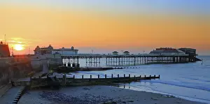 Glow Prints: Cromer Pier at sunset, summer evening, Norfolk, England, UK