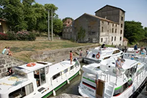 Aude Prints: Crowded lock and towpath on the Canal du Midi, Trebes, Aude, Languedoc Roussillon