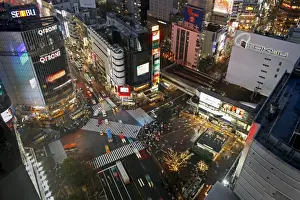 Crowds crossing the famous Shibuya Crossing crosswalks at the centre of Shibuyas fashionable shopping and entertainment district. Shibuya, Tokyo