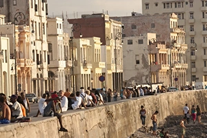 Malecon Prints: Crowds of people sitting on sea wall on the Malecon, in Havana, Cuba, West Indies