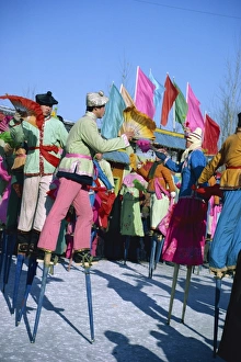 New Year Prints: Crowds of stilt dancers celebrate Chinese New Year, China, Asia
