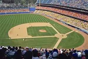 Baseball Prints: Crowds watch baseball game at the Dodgers Stadium in Los Angeles