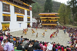 Bhutan Prints: Crowds watching the dancers at the Paro festival, Paro, Bhutan, Asia