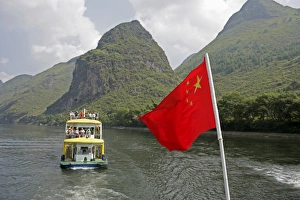 Guilin Prints: Cruise boat with Chinese flag on Li River between Guilin and Yangshuo, Guilin