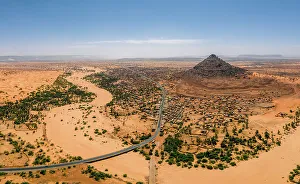 Highway Prints: A crumbling mountain, a river bed