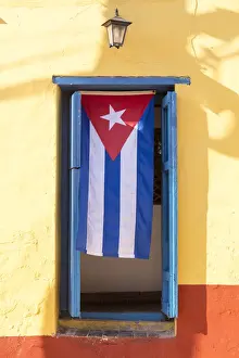 Patriotism Prints: Cuban Flag in doorway, Trinidad, UNESCO World Heritage Site, Sancti Spiritus, Cuba
