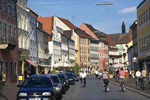 Cycling through town, Freising, Bavaria, Germany, Europe