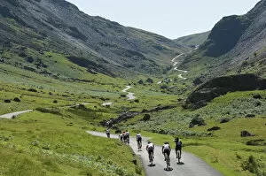 Cumbria Gallery: Cyclists ascending Honister Pass, Lake District National Park, Cumbria, England, United Kingdom