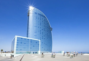 Cyclists outside the Hotel W at Barceloneta, Barcelona, Catalonia (Catalunya), Spain