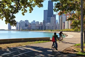 Cycling Prints: Cyclists riding along Lake Michigan shore with the Chicago skyline beyond