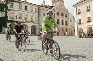 Cyclists riding through Namesti (square) in town of Mikulov, Brnensko Region