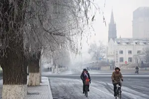 Bike Prints: Cyclists in a winter wonderland and Catholic church in Jilin City, Jilin Province