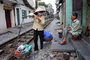 Small Business Prints: Daily life by the railway tracks in central Hanoi